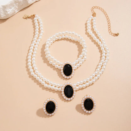 Ensemble de Bijoux Élégant en Perles et Strass: Collier, Bracelet et Boucles d'Oreilles